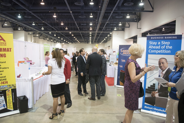 Attendees and vendors interact on the exhibition floor during the Las Vegas Metro Chamber Of Commerce Business Expo at Cashman Center in Las Vegas, Wednesday, June 10, 2015. (Jason Ogulnik/Las Veg ...