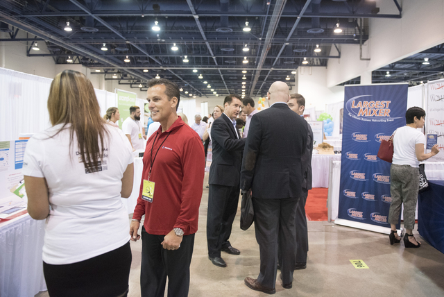 Attendees and vendors interact on the exhibition floor during the Las Vegas Metro Chamber Of Commerce Business Expo at Cashman Center in Las Vegas, Wednesday, June 10, 2015. (Jason Ogulnik/Las Veg ...
