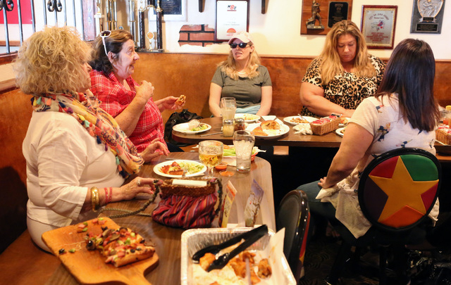 Patrons including Dana Brewer, left, and her friend Susan Lidey, second left, eat at Four Kegs restaurant 276 Jones Boulevard in Las Vegas on Friday, May 22, 2015. Brewer has been a regular custom ...