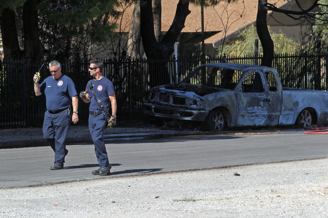 The burnt truck that set three houses on fire is seen on Tuesday, June 16, 2015, in Las Vegas. A vehicle fire spread and set three other homes on fire. (James Tensuan/Las Vegas-Review Journal) Fol ...
