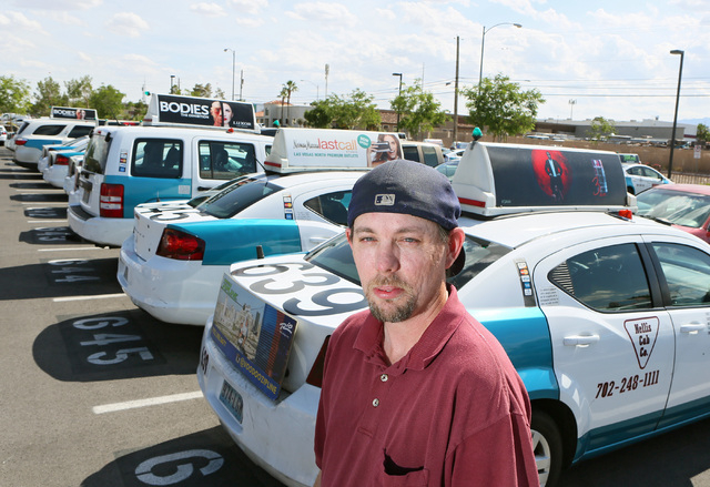 Taxi cab driver Greg Janz stands outside parked cabs at Nellis Cab Co. headquarters, located at 5490 Cameron St., Tuesday, May 26, 2015, in Las Vegas. Last April, Janz turned in a media case that  ...