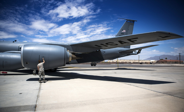 An airman from the 91st Air Refueling Squadron from MacDill AFB does a post flight check on a KC-135 Stratotanker Wednesday, June 10, 2015 at Nellis Air Force Base. The squad participated in Green ...