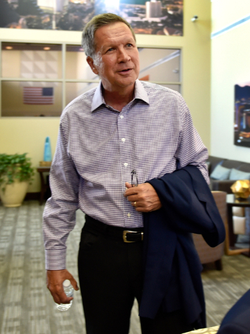 Ohio Gov. John Kasich stands as an interview concludes at Atlantic Aviation in Las Vegas on Thursday, June 11, 2015. Kasich, a potential Republican presidential candidate, is scheduled to appear a ...