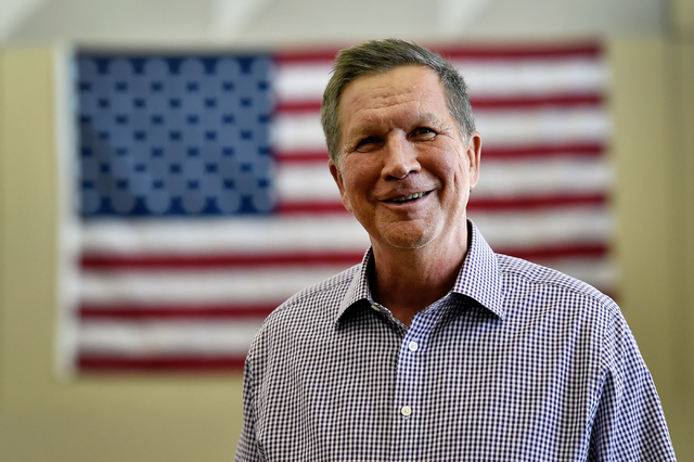 Ohio Gov. John Kasich smiles before an interview at Atlantic Aviation in Las Vegas on Thursday, June 11, 2015. Kasich, a potential Republican presidential candidate, is scheduled to appear at a lo ...