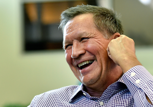 Ohio Gov. John Kasich speaks during an interview at Atlantic Aviation in Las Vegas on Thursday, June 11, 2015. Kasich, a potential Republican presidential candidate, is scheduled to appear at a lo ...