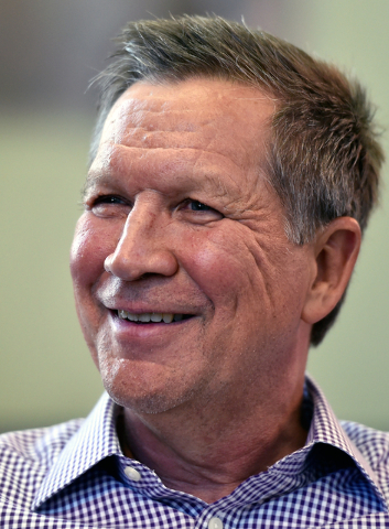 Ohio Gov. John Kasich speaks during an interview at Atlantic Aviation in Las Vegas on Thursday, June 11, 2015. Kasich, a potential Republican presidential candidate, is scheduled to appear at a lo ...