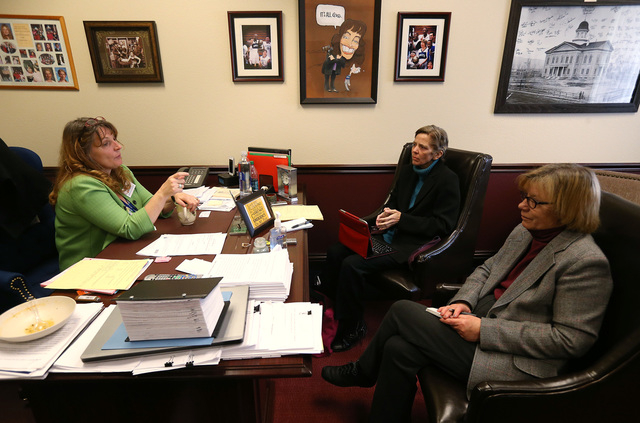 Nevada Assembly Minority Leader Marilyn Kirkpatrick, D-North Las Vegas, talks with Las Vegas Review-Journal reporters Laura Myers, center, and Sandra Chereb at the Legislative Building in Carson C ...