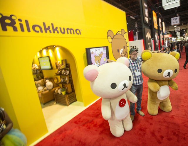 Greg Nuson poises for a photo with Rilakkuma cartoon characters  during  the Licensing Expo 2015 at the Mandalay Bay Convention Center, 3950 South Las Vegas Boulevard on Tuesday, June 9, 2015. Ove ...