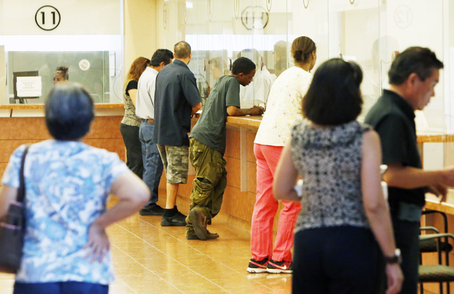 People pay their citations at the Municipal Court payment counter on the first floor of Regional Justice Center on Friday, June 12, 2015. (Bizuayehu Tesfaye/Las Vegas Review-Journal) Follow Bizu T ...