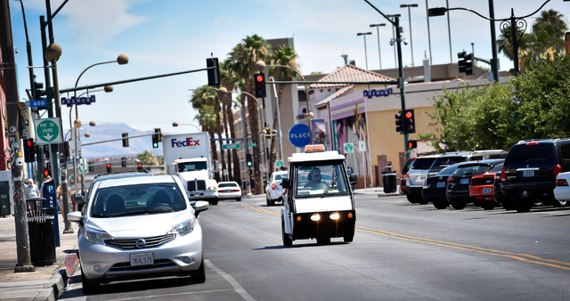 Parking enforcement officer Joshua Kuykendall patrols along 7th Street in downtown Las Vegas on Friday, June 12, 2015. (David Becker/Las Vegas Review-Journal)