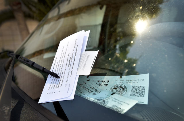 A parking citation for an expired meter is displayed on a vehicle parked along 6th Street in downtown Las Vegas on Friday, June 12, 2015. (David Becker/Las Vegas Review-Journal)
