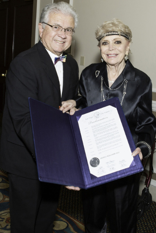 Las Vegas City Councilman Bob Coffin and Myrna Williams pose on Sunday, June 7, 2015, with the "Myrna Williams Day" proclamation issued by the council. (Courtesy, Williams family)