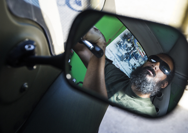 Peter Guidry, co-founder of  Forgotten Not Gone, 3355 Clayton Street, sits inside an enclosed tricycle on Monday, June 22, 2015. The nonprofit  provides trikes for veterans and their families to   ...