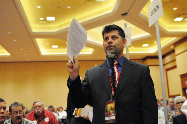 Bill Carns, committee chair at the Nevada Republican Party, speaks gives his opinion on an amendment during the annual Nevada Republican Party convention at the South Point casino-hotel in Las Veg ...