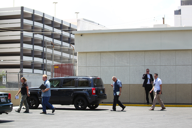 Las Vegas police investigate the scene of a shooting at a gas station on Paradise Road at Riviera Boulevard in Las Vegas on Wednesday, June 10, 2015. (Chase Stevens/Las Vegas Review-Journal)