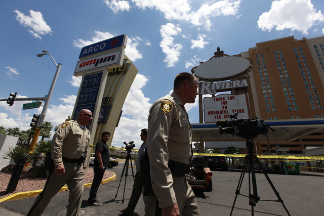 Las Vegas police investigate the scene of a shooting at a gas station on Paradise Road at Riviera Boulevard in Las Vegas on Wednesday, June 10, 2015. (Chase Stevens/Las Vegas Review-Journal)