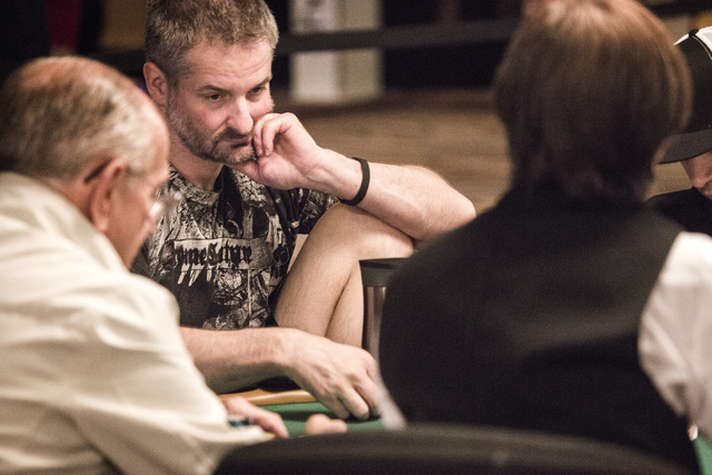 Poker player Tony Cousineau,center, during the Omaha Hi-Lo 8 or Better game at the World Series of Poker at the Rio  Convention Center, 3700 West Flamingo Road on Friday, May 29, 2015. (Jeff Schei ...