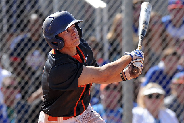 Bishop Gorman shortstop Cadyn Grenier (2) hits a walk-off home run against Green Valley in the ninth inning of the NIAA Division 1 State championship baseball game at Durango High School in Las Ve ...