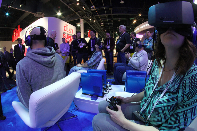 Oculus Rift prototype sets are pictured in action at the Consumer Electronics Show January 2013 in Las Vegas, Nevada. (Courtesy CNN)