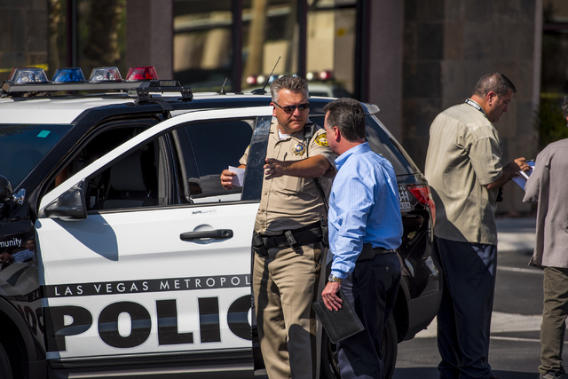 Las Vegas police investigate the scene of a shooting on the 8700 block of Maryland Parkway in Las Vegas on Wednesday, June 10, 2015. (Joshua Dahl/Las Vegas Review-Journal)