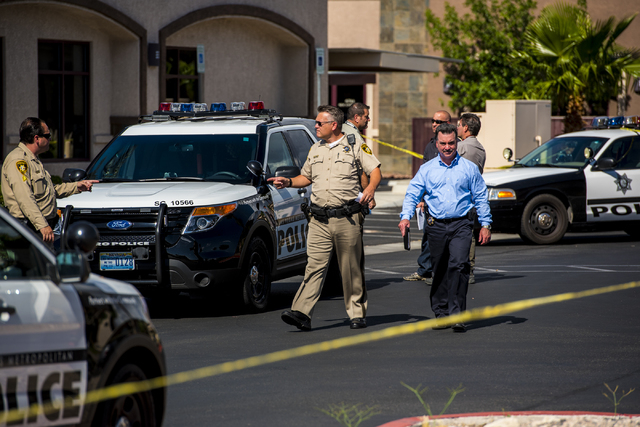 Las Vegas police investigate the scene of a shooting on the 8700 block of Maryland Parkway in Las Vegas on Wednesday, June 10, 2015. (Joshua Dahl/Las Vegas Review-Journal)