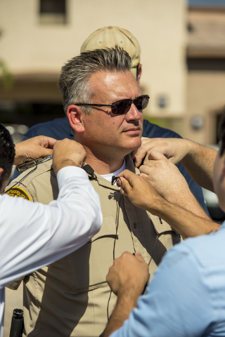 Lieutenant Troy Barrett of the Las Vegas Police Department has microphones placed on him by media at the scene of a shooting on the 8700 block of Maryland Parkway in Las Vegas on Wednesday, June 1 ...