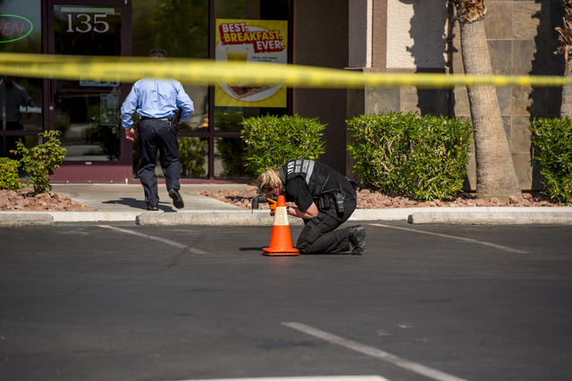 Las Vegas police investigate the scene of a shooting on the 8700 block of Maryland Parkway in Las Vegas on Wednesday, June 10, 2015. (Joshua Dahl/Las Vegas Review-Journal)