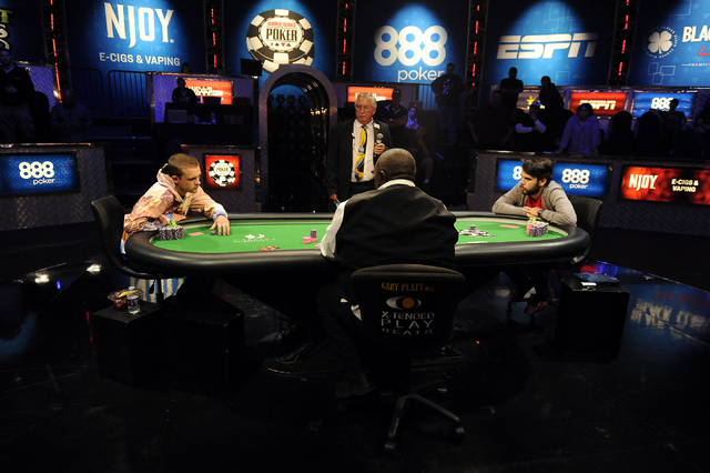 Poker players Javier Zarco of Madrid, right, and Adrian Buckley of Westminster, Colo., go head to head during the final round of the $1.2 million Millionaire Maker tournament at the World Series o ...