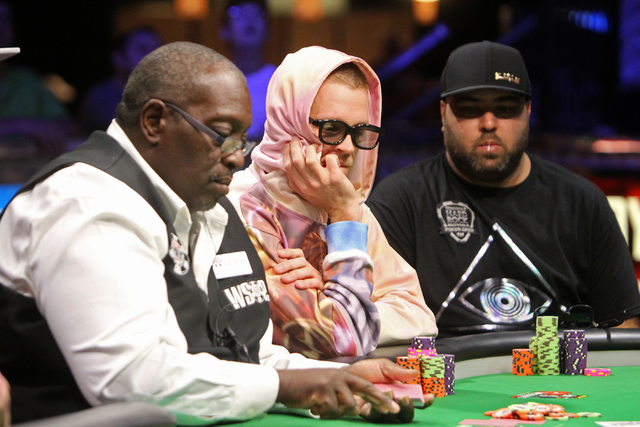 Adrian Buckley, center, and Mohammad Siddiqui, right participate in the Millionaire Maker at the Rio hotel-casino on Tuesday, June 9, 2015, in Las Vegas. Thousands had entered to compete in the Mi ...