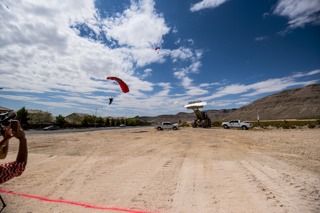 A skydiver lands during the groundbreaking ceremony of The Cliffs, a new development in Summerlin, in Las Vegas on Wednesday, June 10, 2015. (Joshua Dahl/Las Vegas Review-Journal)