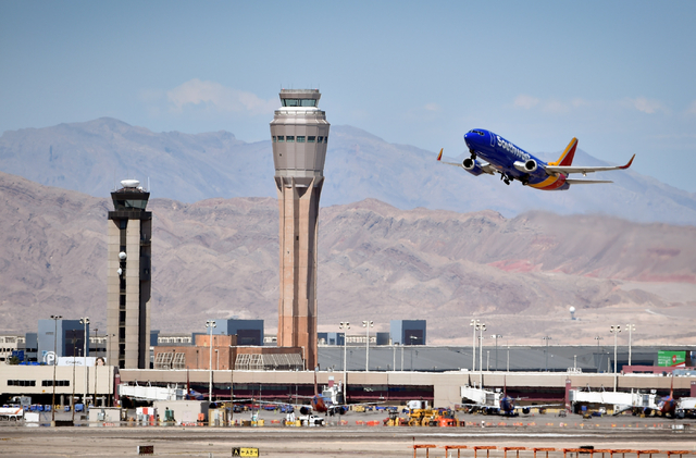 A Southwest Airline passenger jet takes off from McCarran International Airport under the control of the smaller of the two federal air traffic control towers on Monday, June 8, 2015. The new 352- ...