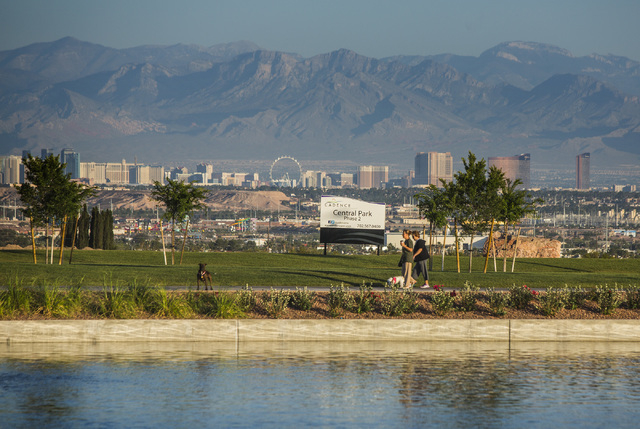 People take a morning walk in Central Park at Cadence, a 2,200 acre planned community, near Lake Mead Parkway east of Boulder Highway in Henderson is seen Wednesday, June 3, 2015
(Jeff Scheid/Las  ...