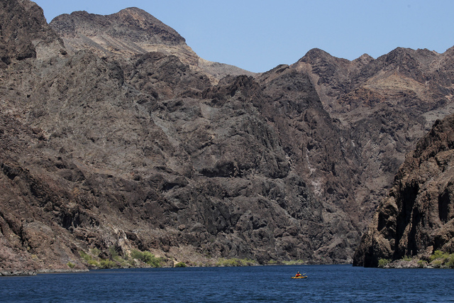 A kayaker explores the Black Canyon Water Trail on the Lower Colorado River in Lake Mead National Recreation Area on the Nevada and Arizona border east of Las Vegas on Thursday, July 3, 2014. (Jas ...