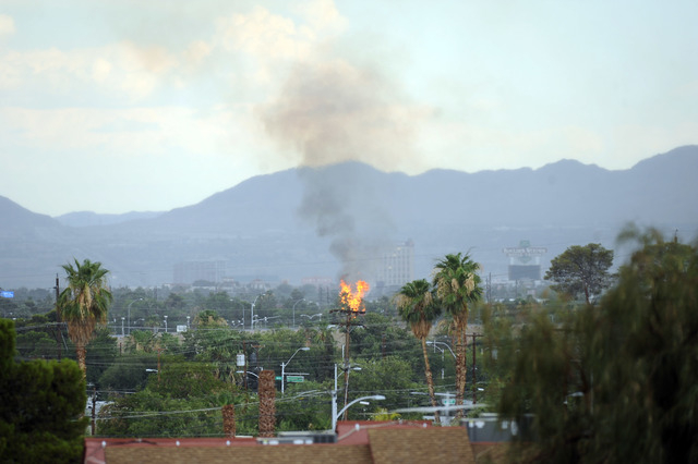 A tree fire is seen during a thunderstorm near the Boulder Station Casino taken from Cashman Field Sunday June 14, 2015. (Josh Holmberg/Las Vegas Review Journal)