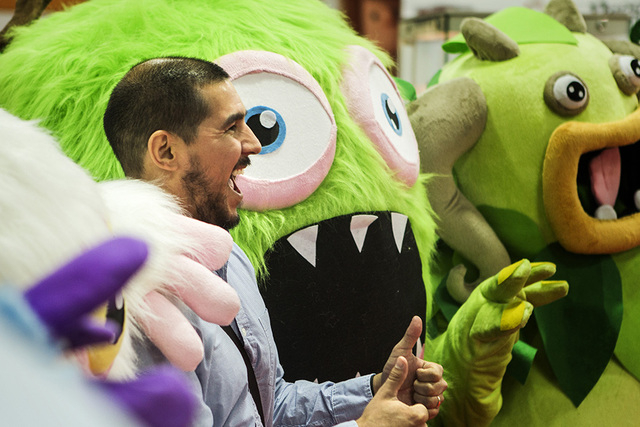 Benjamin Soto poises with the My Singing Monsters during the Licensing Expo 2015 at the Mandalay Bay Convention Center, 3950 South Las Vegas Boulevard on Tuesday, June 9, 2015. Over 15,000 attende ...