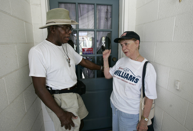 RJ FILE*** LOCAL - Clark County Commission, District E, Myrna Williams, right, talks with Major Magwood as she walks door-to-door while campaigning for re-election on a summer day in Las Vegas Fri ...