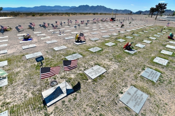 Grave markers are seen in a newly seeded area at the Southern