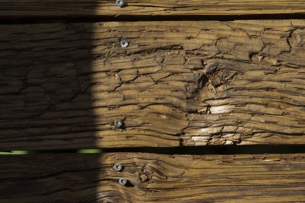 Worn down wooden planks are seen along the boardwalk at the Red Springs picnic area in the Red Rock Canyon National Conservation Area on Tuesday, July 21, 2015. A portion of the boardwalk is close ...