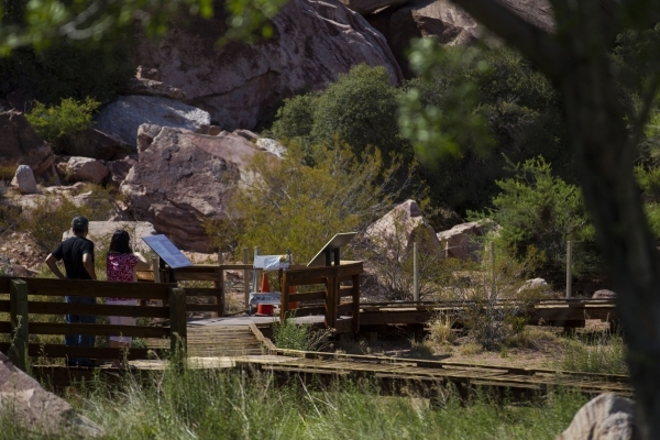 John Lin, left, and Nan Lin pause as they approach a blocked off portion of the boardwalk at the Red Springs picnic area in the Red Rock Canyon National Conservation Area on Tuesday, July 21, 2015 ...