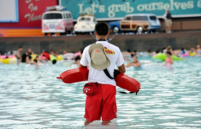 A lifeguard keeps his eyes on swimmers in the wave pool during the opening day of Cowabunga Bay in Henderson on Friday, July 4, 2014. (David Becker/Las Vegas Review-Journal)