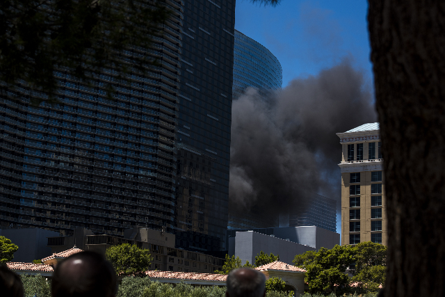 Smoke billows from a fire at the pool of The Cosmopolitan hotel-casino on the strip in Las Vegas on Saturday, July 25, 2015. (Joshua Dahl/Las Vegas Review-Journal)