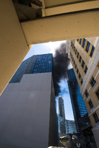Smoke billows from a fire at the pool of The Cosmopolitan hotel-casino on the strip in Las Vegas on Saturday, July 25, 2015. (Joshua Dahl/Las Vegas Review-Journal)