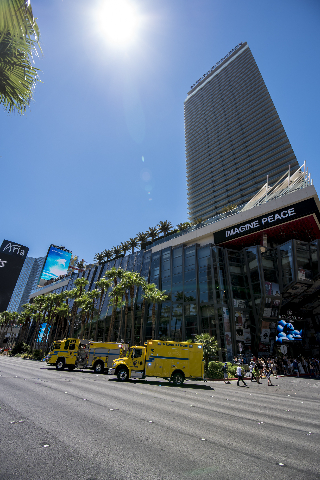 Clark County and Las Vegas fire units park on Las Vegas Blvd as they respond to a fire at the pool of The Cosmopolitan hotel-casino on the strip in Las Vegas on Saturday, July 25, 2015. (Joshua Da ...