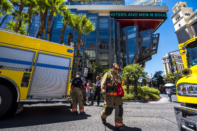 Clark County and Las Vegas fire units park on Las Vegas Blvd as they respond to a fire at the pool of The Cosmopolitan hotel-casino on the strip in Las Vegas on Saturday, July 25, 2015. (Joshua Da ...
