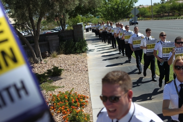 Allegiant Air pilots participate in a picket line outside of the 
 Allegiant Air headquarters, 1201 N. Town Center, in Las Vegas Tuesday, July 28, 2015. (Erik Verduzco/Las Vegas Review-Journal) Fo ...