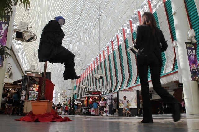 Ron Pickerel, otherwise known as Levitar, performs on Fremont Street on Tuesday, July 28 2015. The city hopes to erect performances zones for street performers in an attempt to clean up downtown.