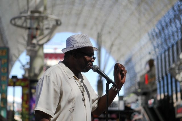 Frank Anderson, otherwise known as Big Frank, sings on Fremont Street on Tuesday, July 28 2015. The city hopes to erect performances zones for street performers in an attempt to clean up downtown.