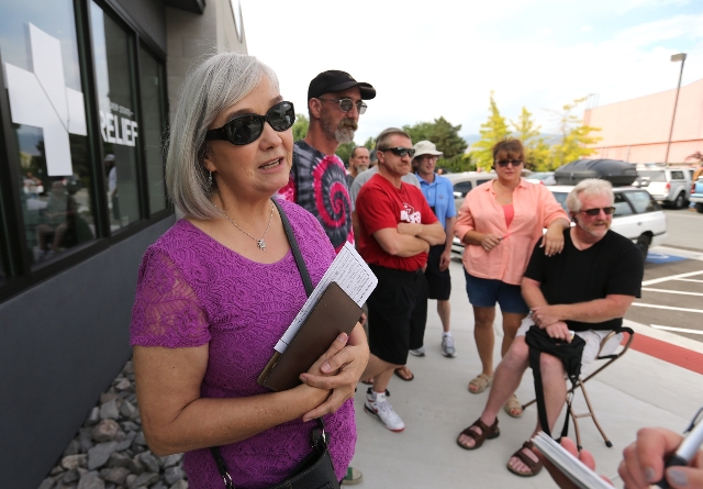 Linda Seibert waits in line outside Silver State Relief in Sparks on Friday, July 31, 2015. More than 50 people with state-authorized medical cards lined up for the opening of the first medical ma ...
