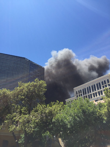 Smoke is seen rising from The Cosmopolitan of Las Vegas on the Strip, Saturday, July 25, 2015. Clark County firefighters were fighting a blaze that started in a cabana at the pool. (Joshua Dahl/La ...