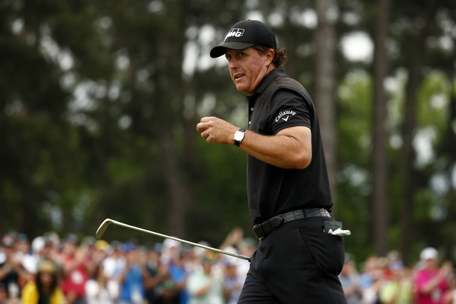 Apr 12, 2015; Augusta, GA, USA; Phil Mickelson reacts after completing the final round of The Masters golf tournament at Augusta National Golf Club. (Rob Schumacher-USA TODAY Sports)